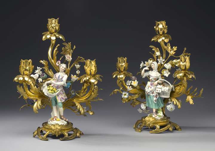 Two figures of the series of the "Cris de Paris"  mounted as three-branch candelabra
